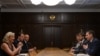 Russian parliament speaker Sergei Naryshkin (front right) meets with France's National Front leader Marine Le Pen (left) in Moscow last week. Analysts say the Kremlin and France's far-right share a similar ideological model based on an aggressive anti-U.S, Euroskeptic attitude. 